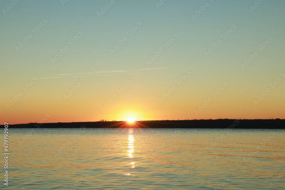 Picturesque view of beautiful sunset over calm river