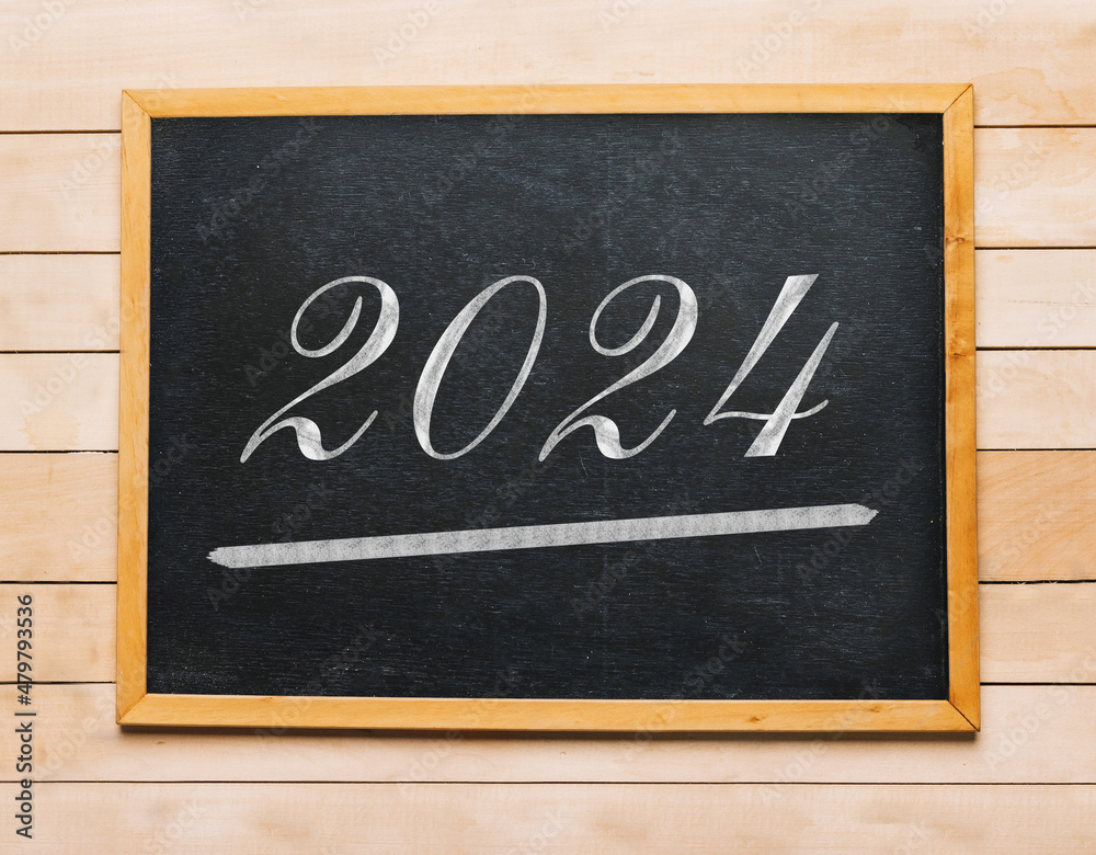 inscription in chalk on a blackboard. School board. date 2024 inscription in chalk on a blackboard. School board. date 2024