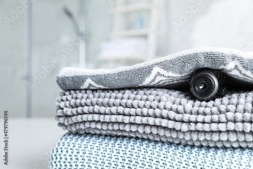 Camera hidden under towel in bathroom, closeup