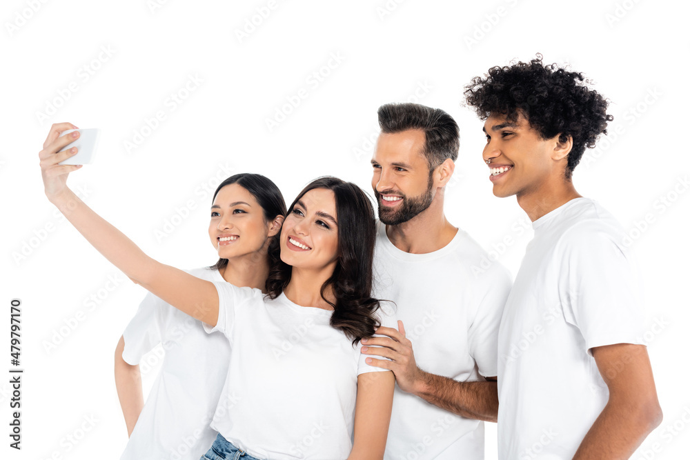 pleased woman taking selfie with interracial friends on mobile phone isolated on white. pleased woman taking selfie with interracial friends on mobile phone isolated on white.