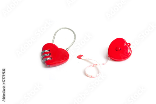 selective focus of miniature workers holding robe of heart and heart shape padlock on white background.