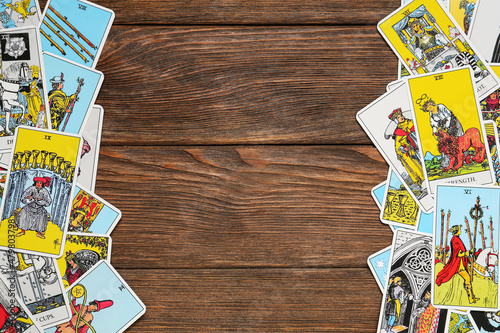 Bild auf Leinwand Tarot cards on wooden table, top view. Space for text