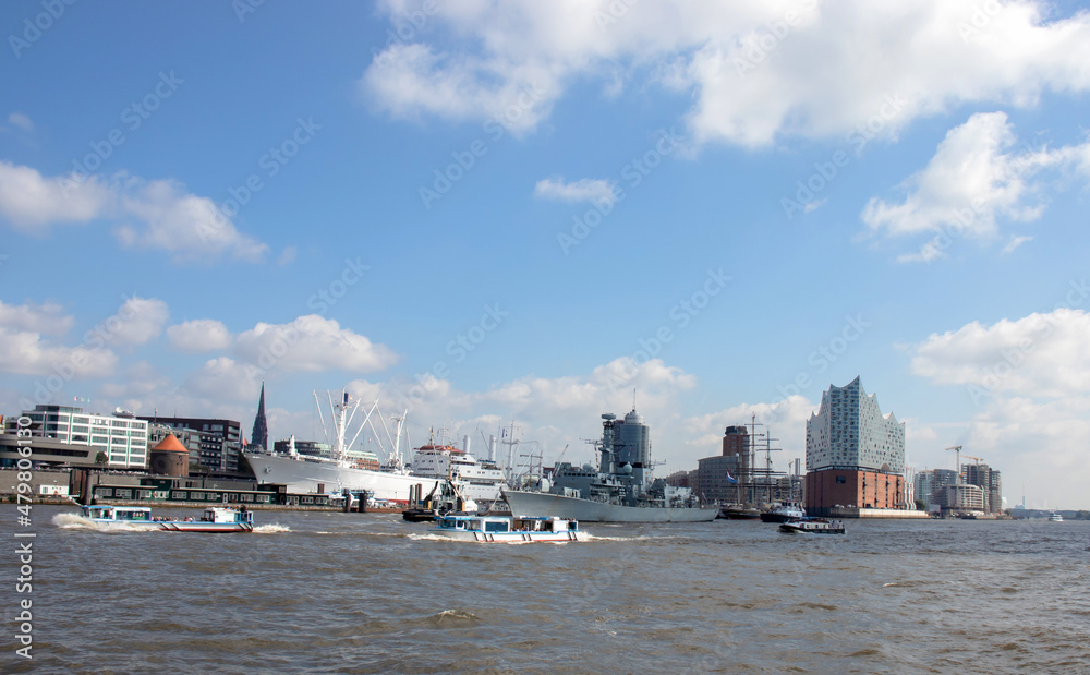Panoramic view of Hamburg city with the Elbe river, Germany, Europe. Beautiful view of crowded Hamburg waterfront, tourist boats and ships.