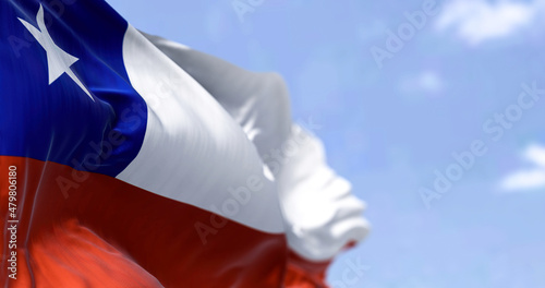 Detailed close up of the national flag of Chile waving in the wind on a clear day photo