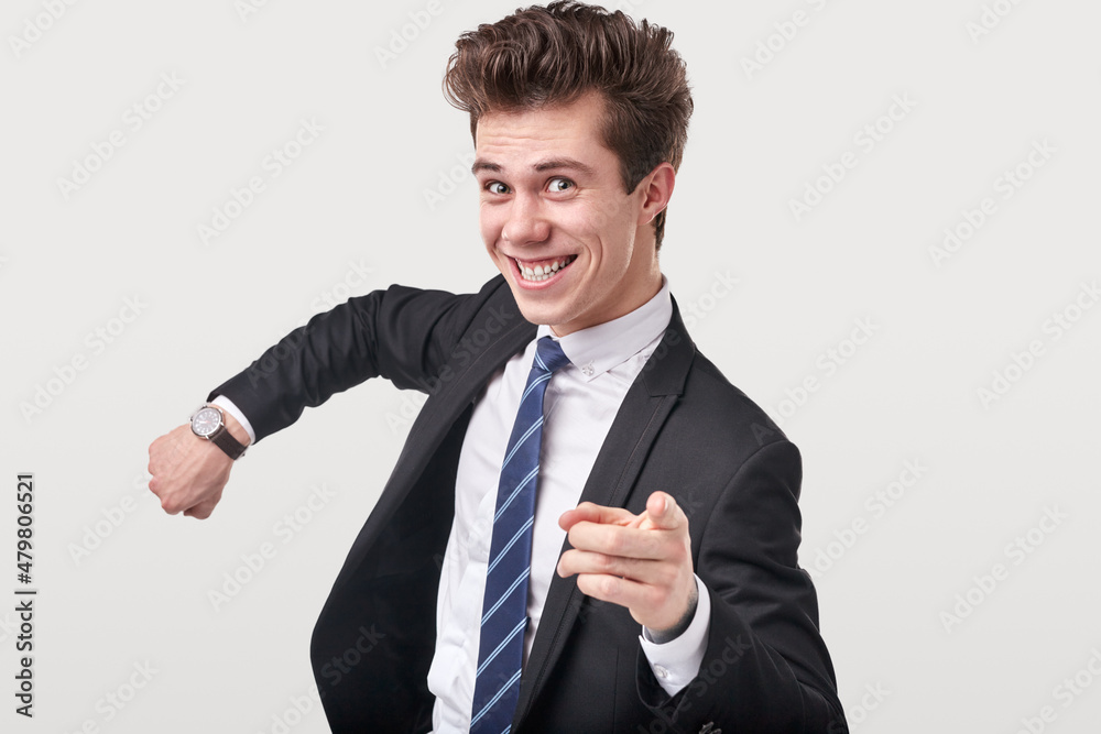 Funny businessman pointing at camera in studio Funny businessman pointing at camera in studio