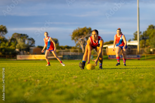 three female footballers at training photo