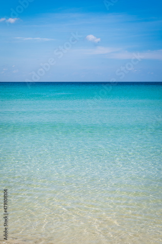 Beach  with clear water with white and golden sand  blue sky  in tropical vacation area. Kata beach in Phuket  Thailand  a photo with copyspace.