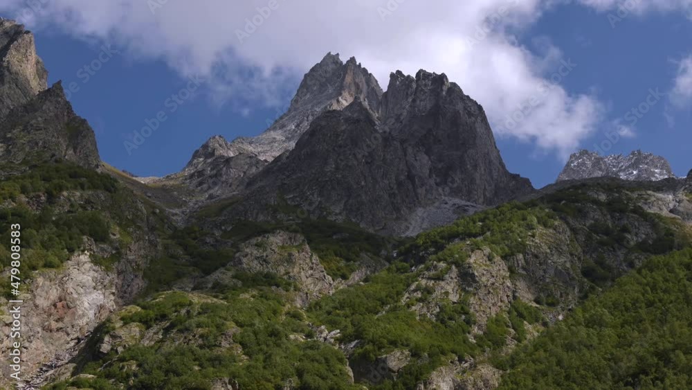 Time-lapse photography of beautiful clouds moving rapidly over high mountains and creating shadows. Summer timelapse epic mountains Time-lapse photography of beautiful clouds moving rapidly over high mountains and creating shadows. Summer timelapse epic mountains