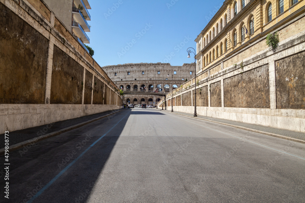 Via degli Annibaldi, with the view of famous Colosseum (Flavian Amphitheatre) in Rome, Italy.