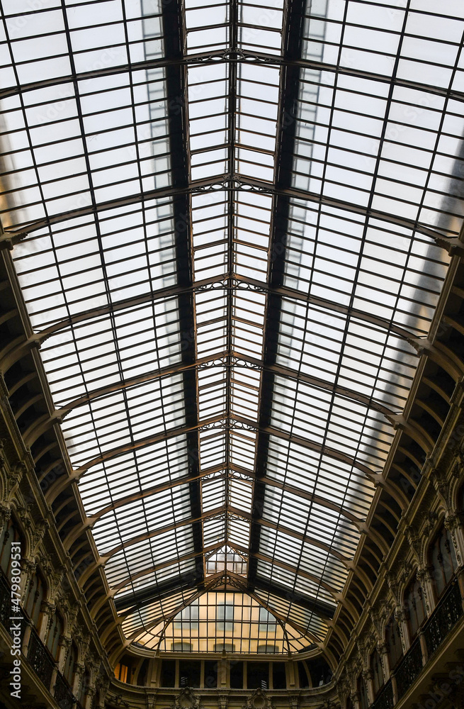 View from below of the glazed roof of Galleria Subalpina (1873), a covered shopping gallery located in the historic centre of Turin, Piedmont, Italy