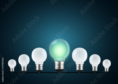 One LED Light bulb glows stand out from all in the dark with a green tone. Concept illustration about outstanding, choose, and winning.
