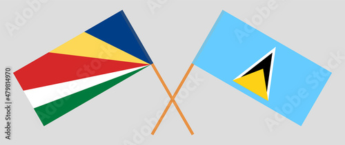Crossed flags of Seychelles and Saint Lucia. Official colors. Correct proportion