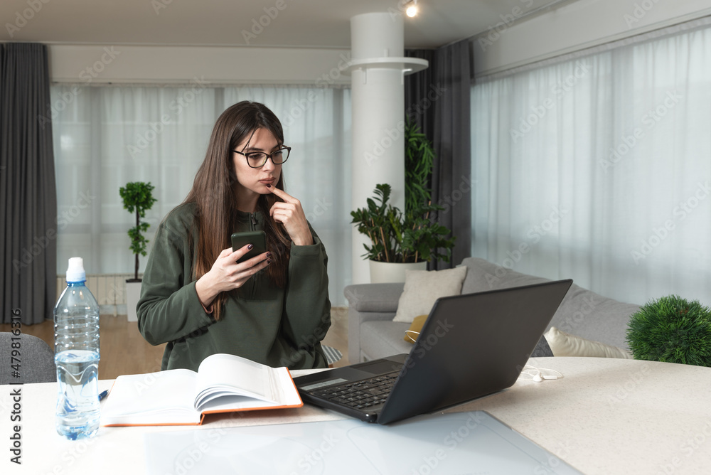 Young sick college student woman sitting at home and preparing for online class over the video conference call on her laptop computer. Online internet education, health care concept. Young sick college student woman sitting at home and preparing for online class over the video conference call on her laptop computer. Online internet education, health care concept.