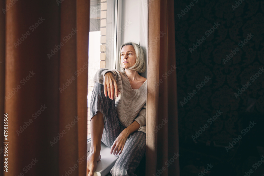 Sad pensive adult 40s woman at home Sad pensive adult 40s woman at home