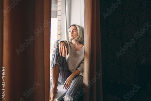 Sad pensive adult 40s woman at home © Tatyana Gladskih
