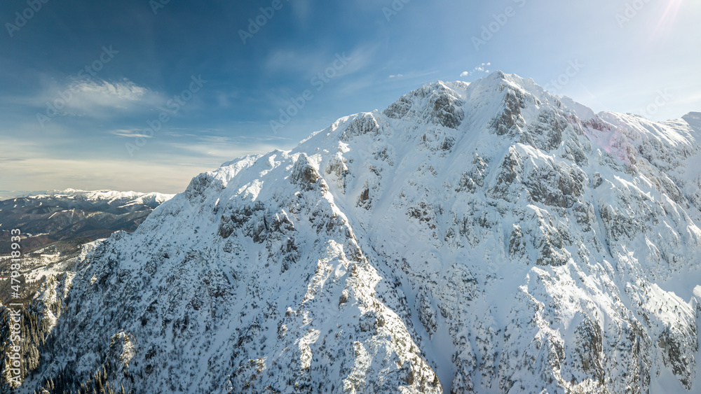 panoramic view of snowy mountain valley, at high altitude, dangerous place for hiking or skiing