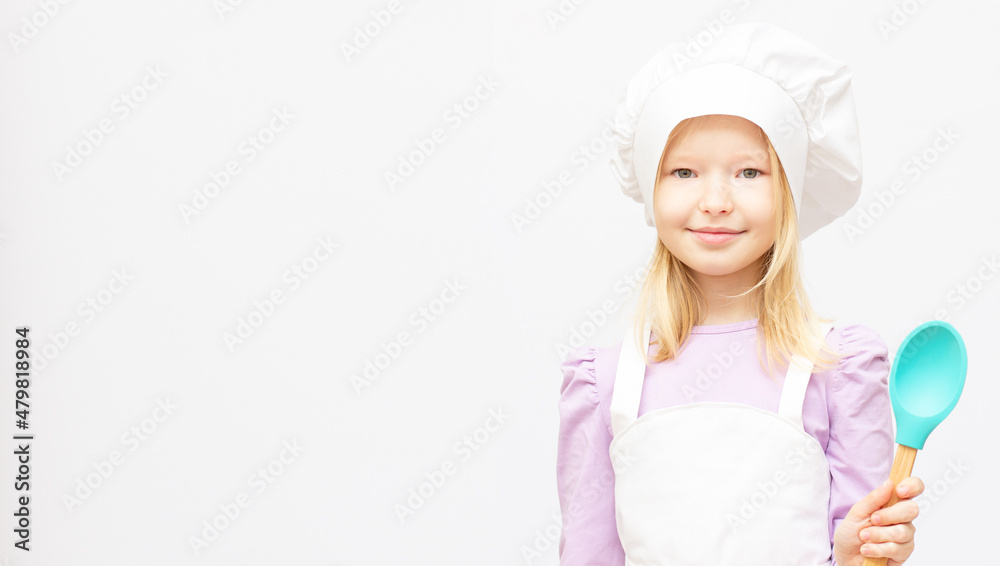 Beautiful little girl in chef uniform isolated on white Beautiful little girl in chef uniform isolated on white