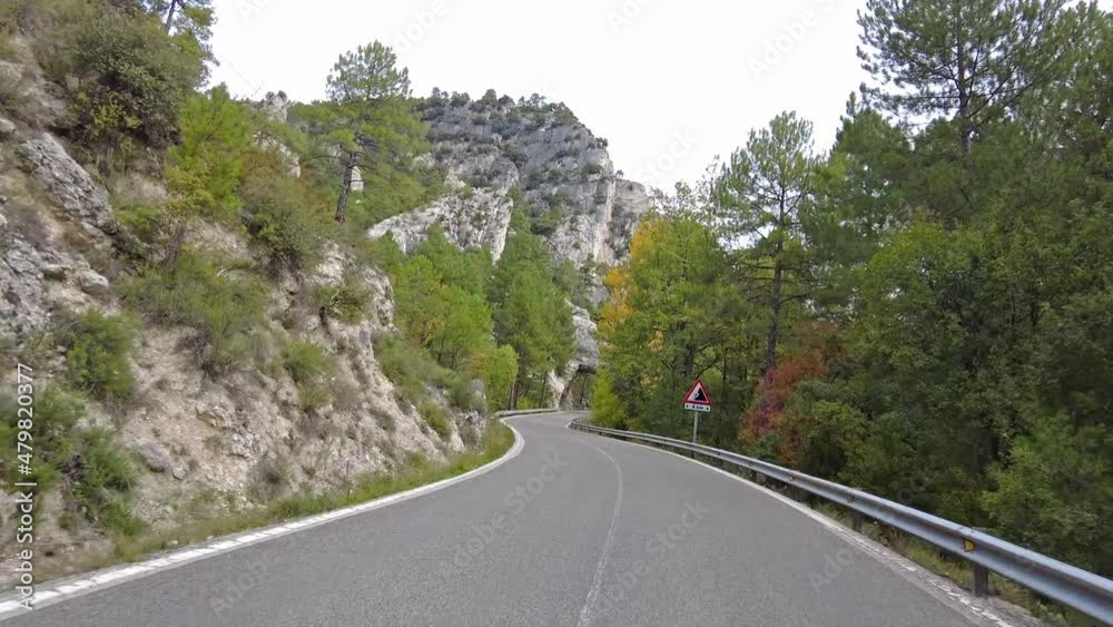 Driving along the karstic cliffs in large lagoon of Tobar at Hoz de Beteta, Cuenca, Castilla la Mancha, Spain, Landscapes of the mountain range of Cuenca