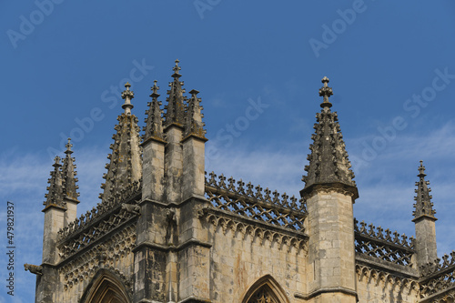 detail of the wall and towers of the Monastery of Santa Maria da Vitoria in Batalha, Portugal