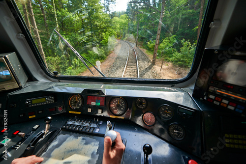 Foto Interior view of the pilot hands and instrument panel cockpit of ancient train