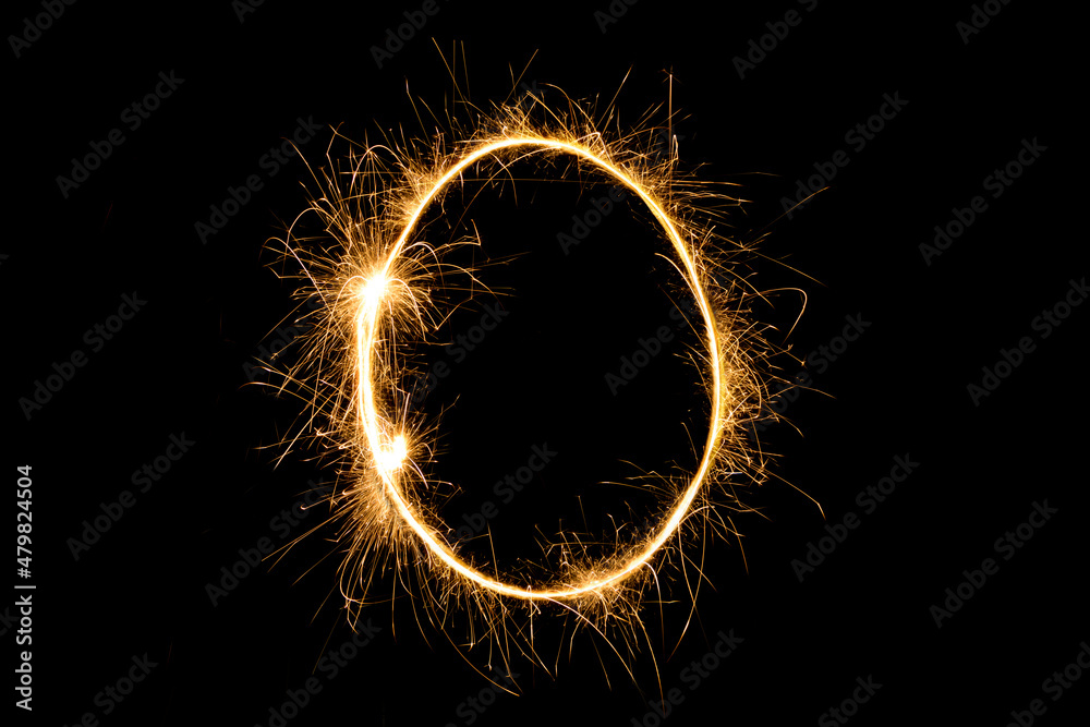 Sparkling number 0 zero isolated on black background