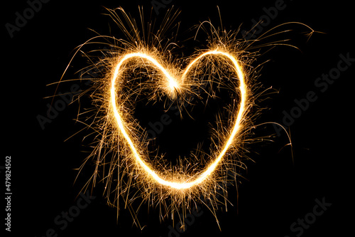 Burning Sparkling heart isolated on black background