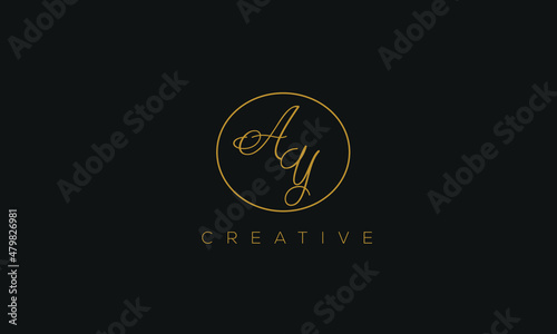 AY is a stylish logo with a creative design and golden color with blackish background.