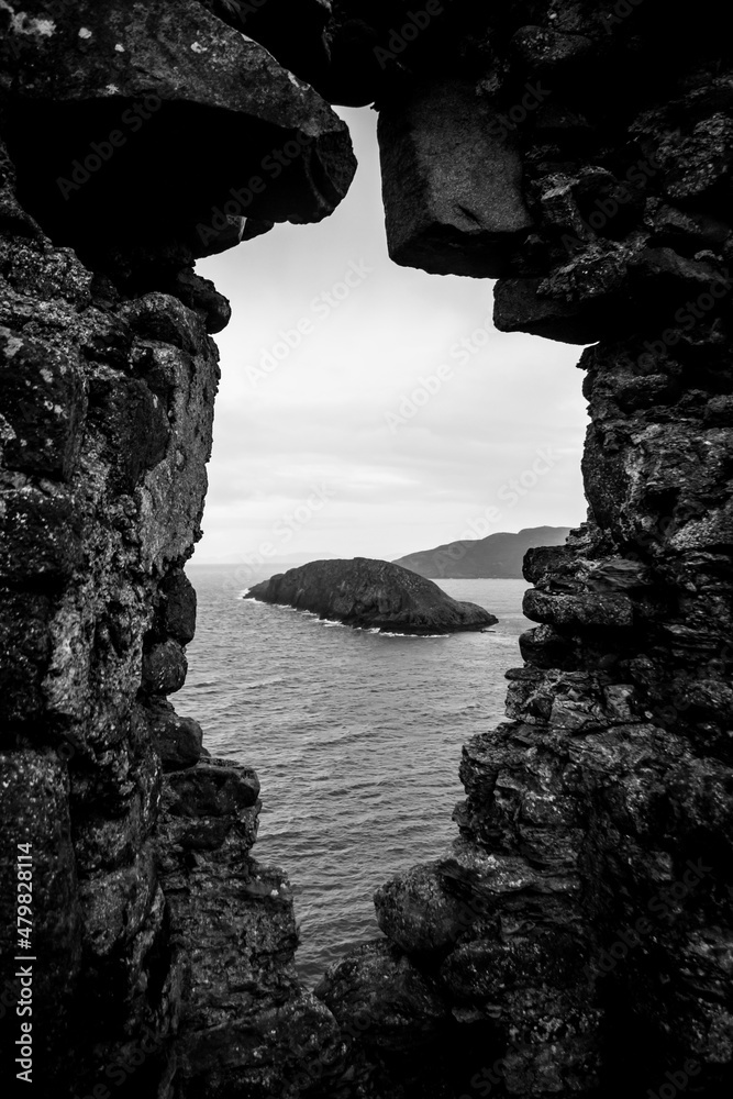 An island view from a cliffside castle window, Isle of Skye, Scotland. 