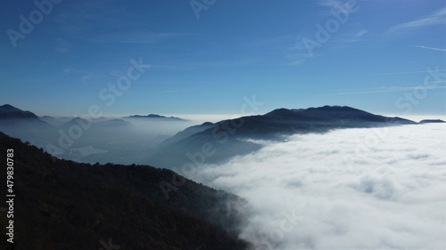 Fog on lake and mountains  northern Italy
