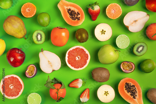 Food background. Assortment of colorful ripe tropical fruits. Top view. Copy space..