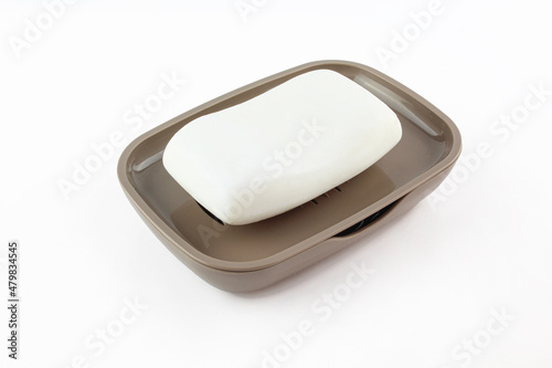 Wallpaper Mural White soap in brown plastic holder case.Bright soap dish isolated on white background  Torontodigital.ca