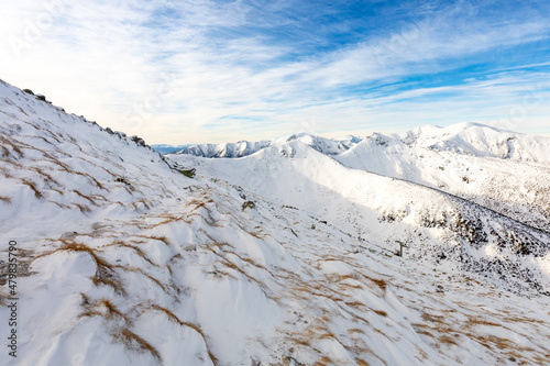 Fototapeta Naklejka Na Ścianę i Meble -  Tatra mountians at winter time. View of the white snow-capped peaks, frosty winter mountains. Kasprowy Wierch, High Tatra, Poland, Europe.