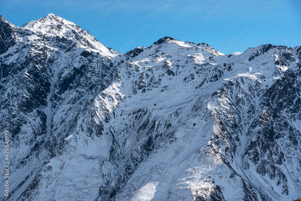 Fototapeta premium Beautiful winter mountains landscape. High snow covered mountains. Georgia, Kazbegi.