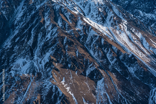 Close up snow covered mountains. Nature mountains texture. © Inga Av