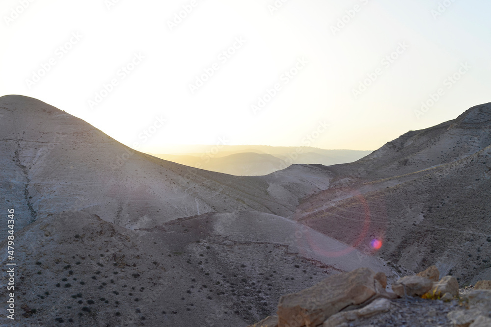 Fototapeta premium Mountain landscape, desert. Stony desert panoramic view. Unique relief geological erosion land form. Stone Desert on the West Bank. Judean Desert in clear weather. 