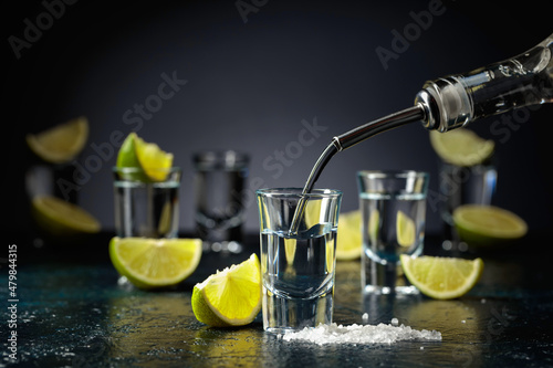 Tequila shots with lime slices and sea salt.