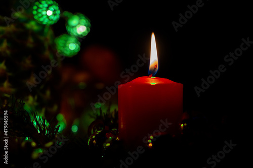 New Year's candle is burning in the dark