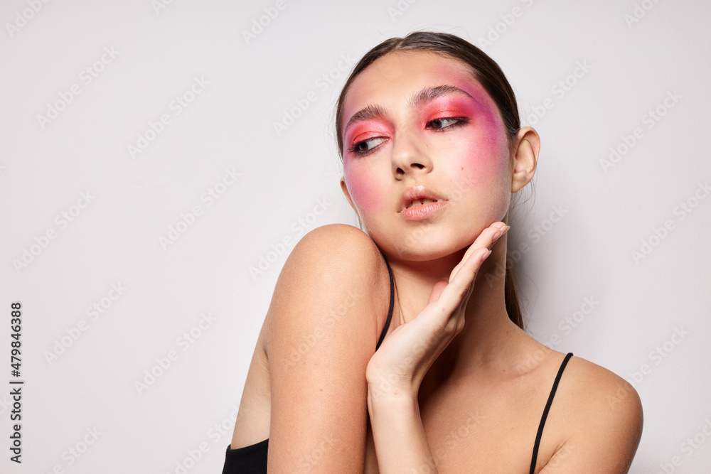 Portrait of beautiful young woman smile bright pink makeup emotions cosmetics cropped view unaltered Portrait of beautiful young woman smile bright pink makeup emotions cosmetics cropped view unaltered