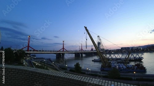 View of the bridge Rákóczi híd over the Danube river in Budapest in the evening. Timelapse. Hungary. Europe photo