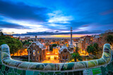 Skyline of Barcelona at dawn seen from Park Guell which was built in 1926