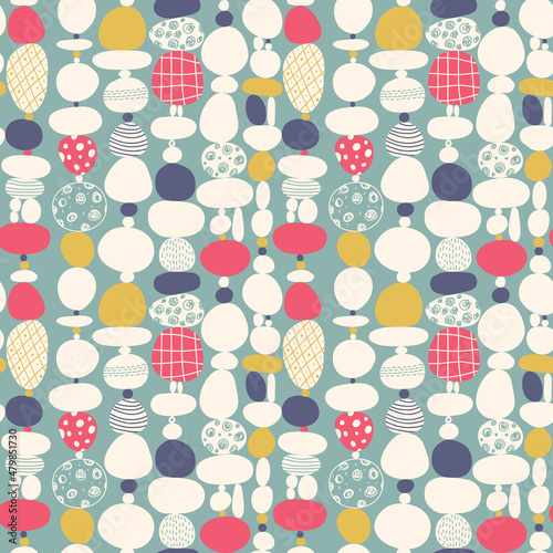 Abstract seamless pattern with colorful pebbles on gray. Bright mosaic terrazzo background. Textile print, vector ethnic texture.