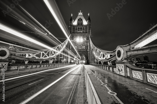 Fototapeta Naklejka Na Ścianę i Meble -  Tower Bridge with evening traffic lights in London. England 