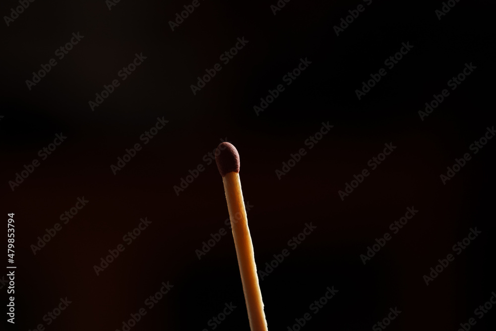 Brown match on black background Brown match on black background