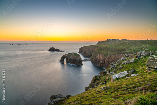 Land's End at sunset with Enys Dodman arch, Cornwall photo