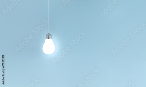Glowing light bulbs in a row on blue background. Horizontal composition with copy space. Creativity and innovation concept.