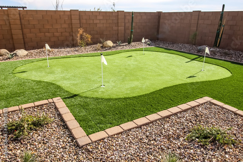 Four Hole Putting Green In Rear Yard
