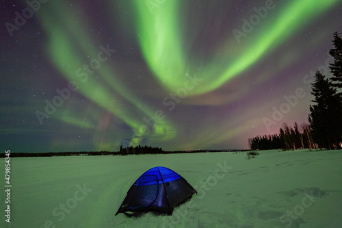 Beauitful aurora over the night sky  with a blue tent below at Chena Lakes