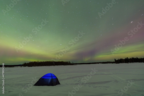 Beauitful aurora over the night sky with a blue tent below at Chena Lakes