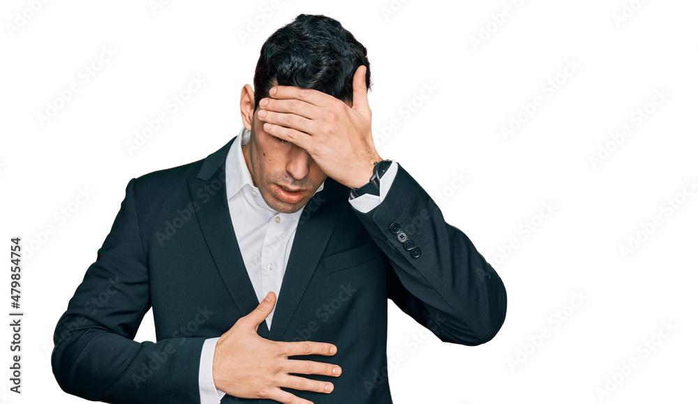 Handsome hispanic man wearing business clothes touching forehead for illness and fever, flu and cold, virus sick Handsome hispanic man wearing business clothes touching forehead for illness and fever, flu and cold, virus sick