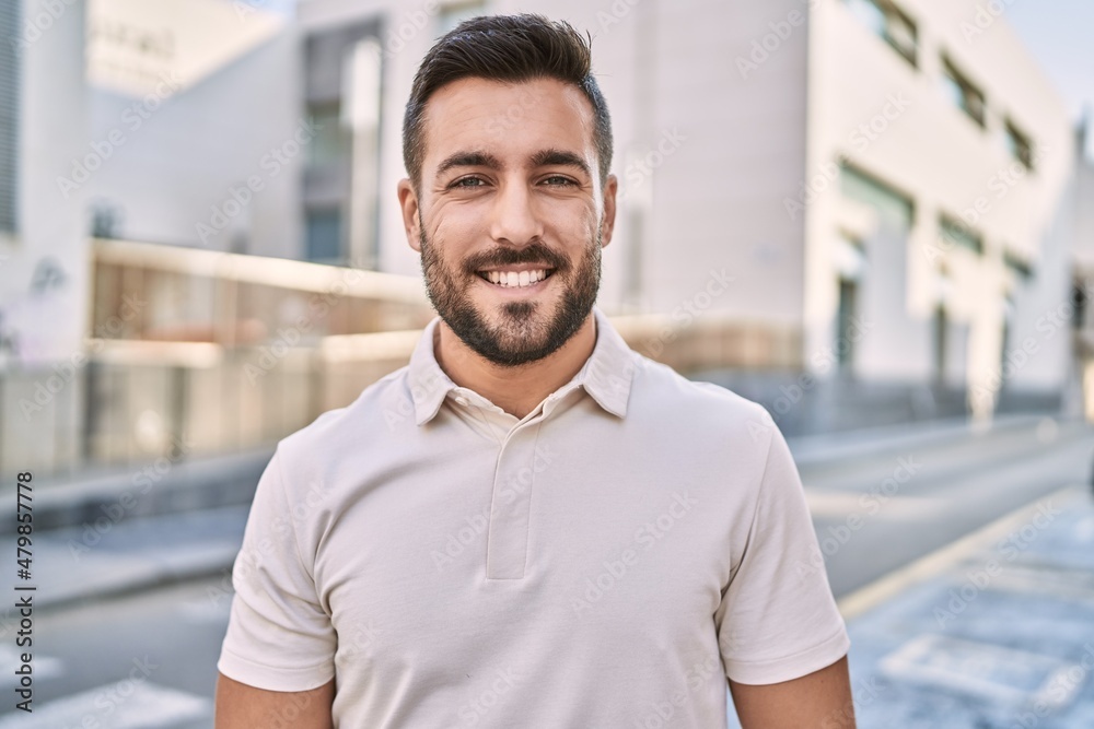 Young hispanic man smiling confident walking at street Young hispanic man smiling confident walking at street